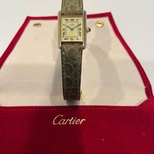 Cartier ladies tank must watch. Elegator strap and clasp closure. Fair condition